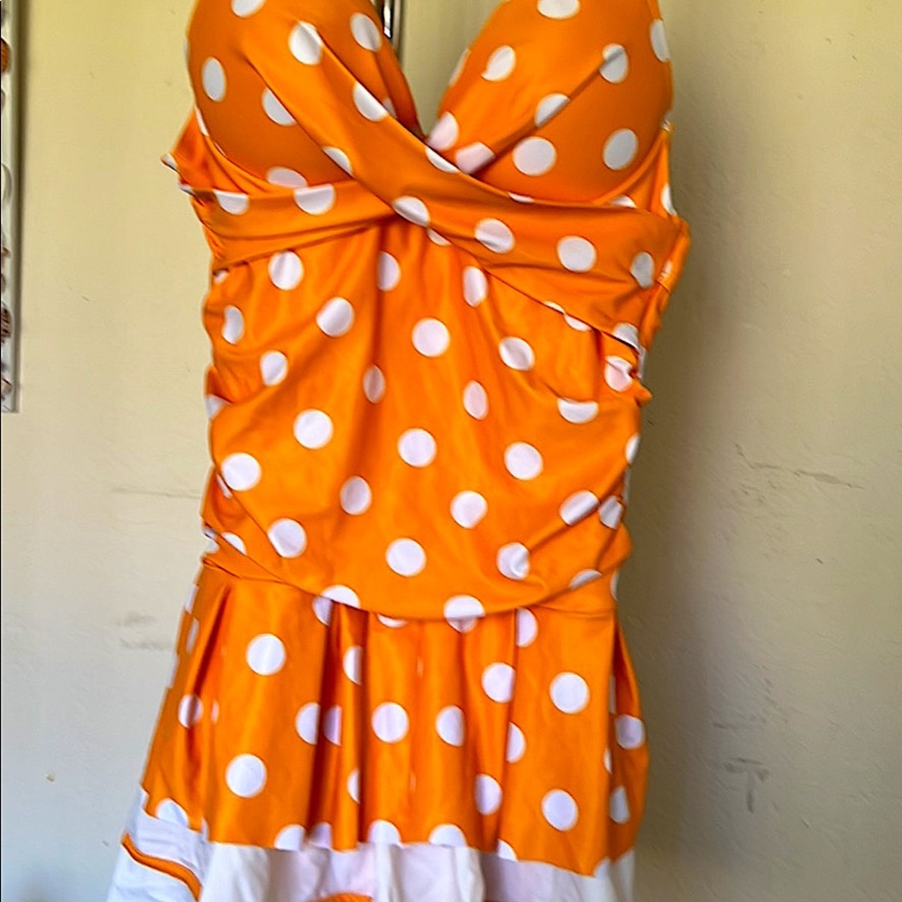 size small cute one piece. New without tags. do not know where it is from.